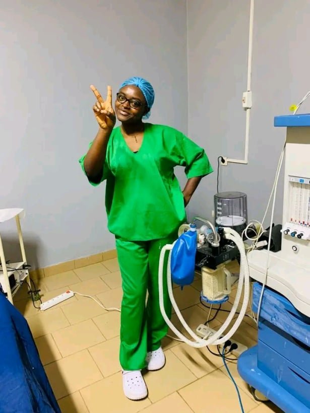 Emergency nurse caring for a patient in a critical care unit
